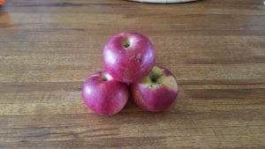 3 apples on cutting board